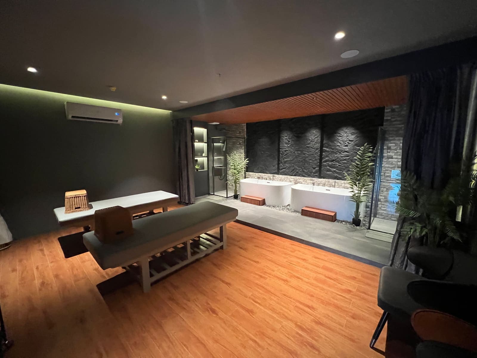 A massage room with twin tubs at a Batam spa