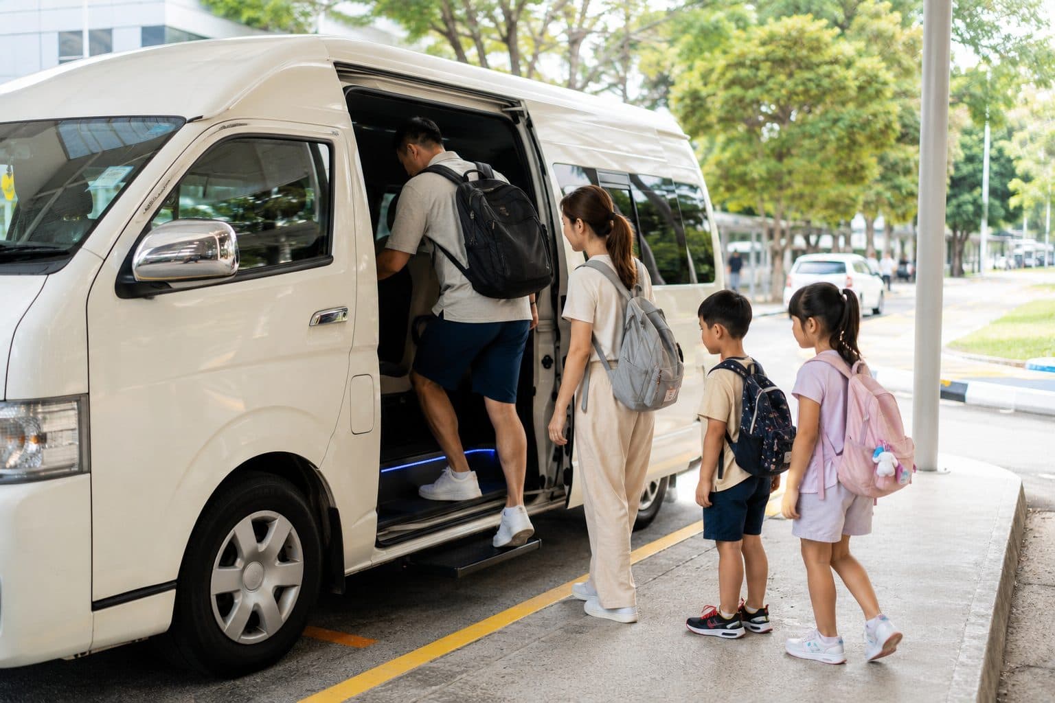 A family boarding their private van for a day in Batam