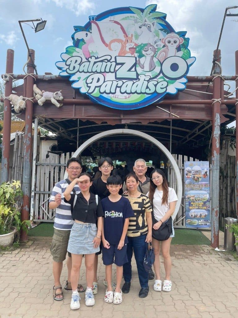 Three generations of one family at the Batam Zoo Paradise gate