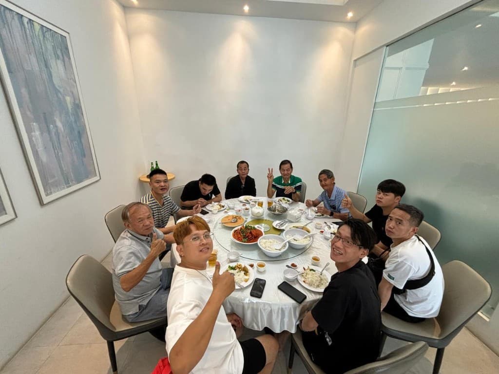 A group around a round table in a private dining room in Batam