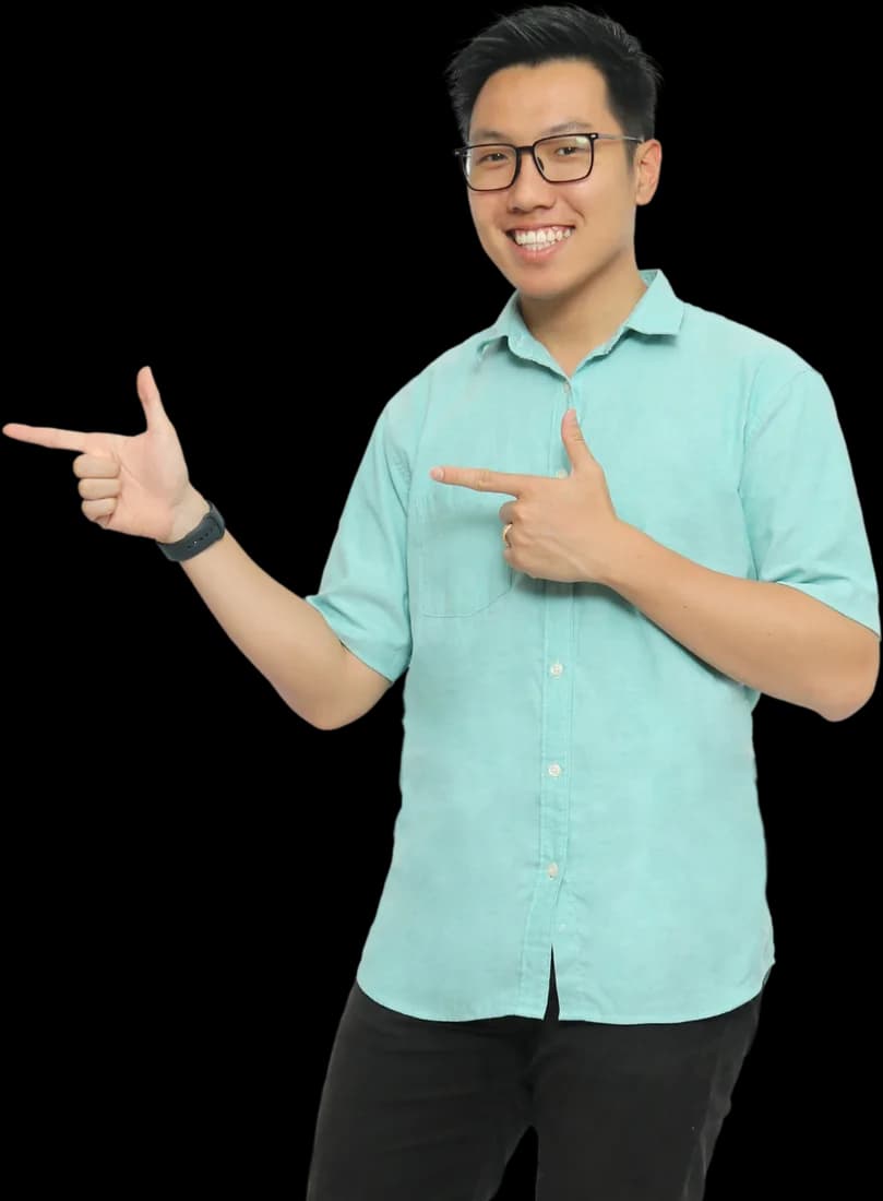 Raymond smiling and pointing across at the words beside him